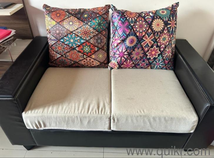 5 seater black and cream sofa in almost new condition form Royal oak