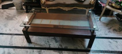 Centre table in teak with scratchless glass very good condition and very heavy 4ft x2ft x1.8ft(1)