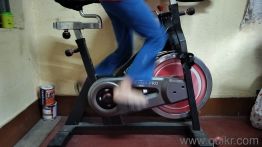 Gym cycle Professional model, used but it's in good condition, need seat cover replacement, rest all good. It's Red and black. Color.(4)