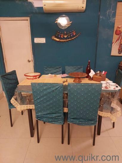 GLASS DINING TABLE WITH ROT IRON BASE