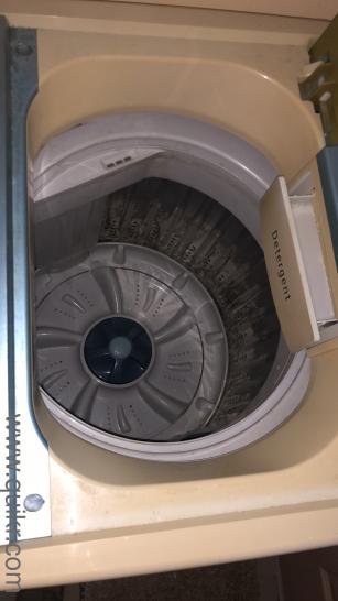 Second hand washing machine but clean working properly along cloth hanger(1)