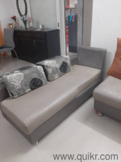L shaped sofa, separable into two with 4 pillows.