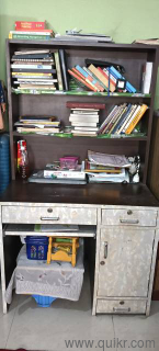a wooden study table in good condition
