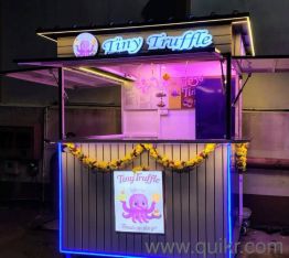 kiosk with lighting and attached stove and sink and chocolate melter