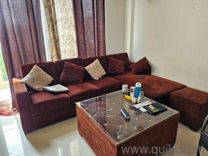 5 seater gently used L shape sofa set with centre table and two puffy