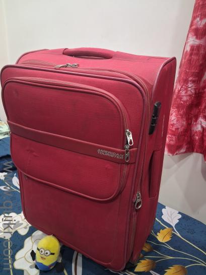 Travelling Trolley Bag that is in almost like new condition. This bag is perfect for all your travel needs, whether for a weekend getaway or a longer trip. It features a spacious mai