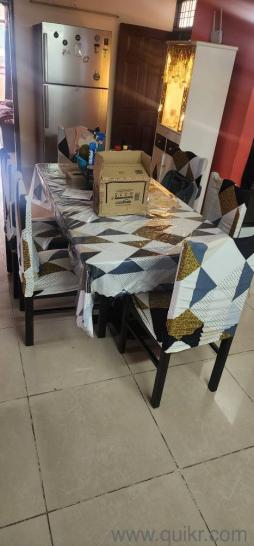 6 seater dining table with heavy base and glass top(1)