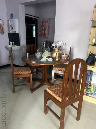 Want to sell used round type dinning table with 4 Chairs
