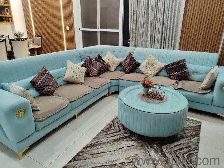 L shape sea green sofa along with central round table(1)