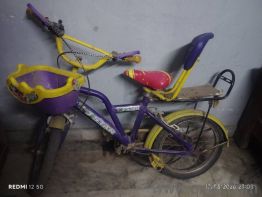 purple and yellow colour kids cycle 