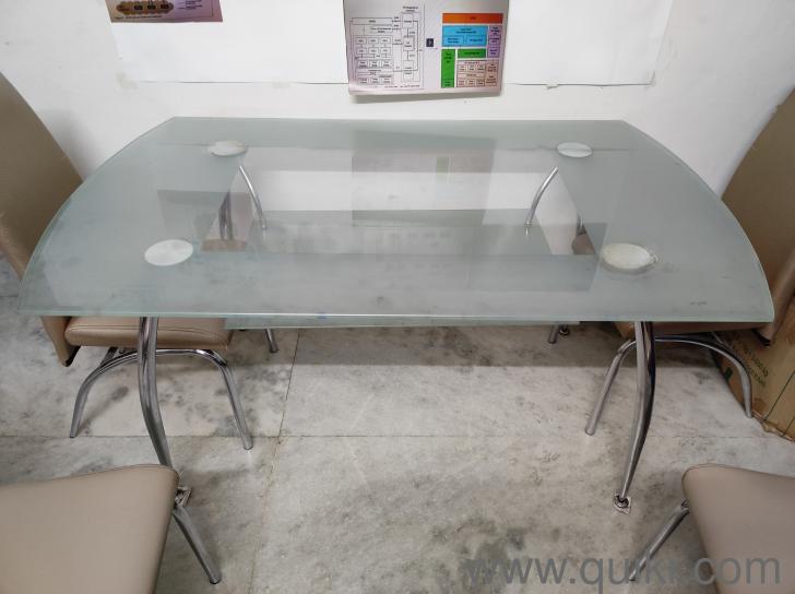 Godrej interio Glass mounted and steel build 6 seater dining table with
