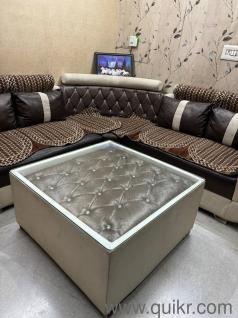 Elegant L-shaped sofa with stylish center table(1)