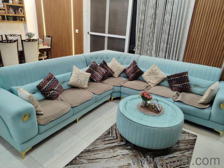 L shape sea green sofa along with central round table(3)